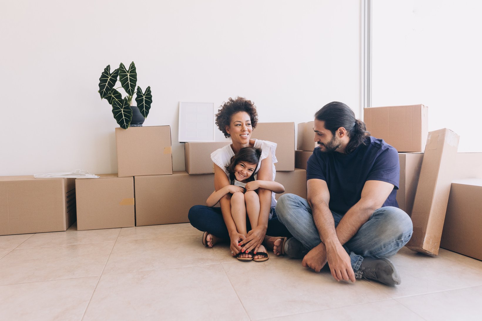 Moving In Family with Packed Boxes